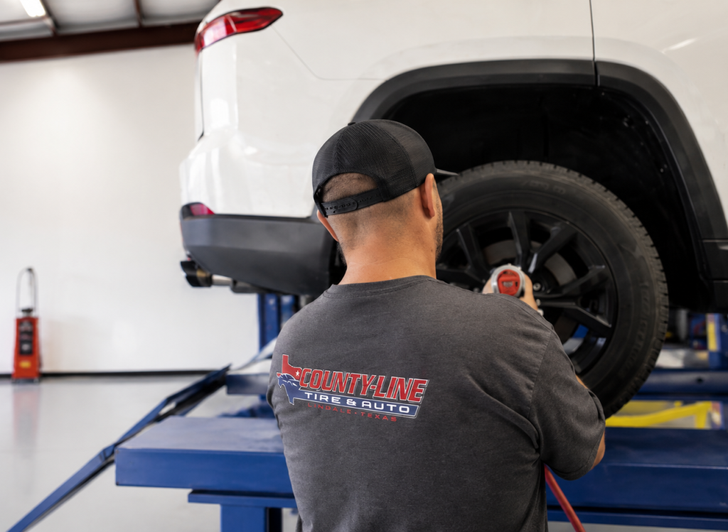 County Line Tire & Auto technician servicing a vehicle in Lindale, Texas